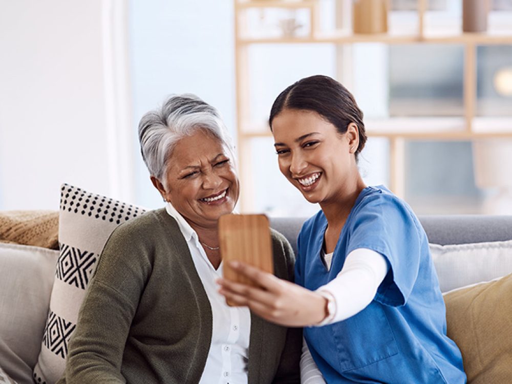 shot-of-a-young-nurse-taking-selfies-with-a-senior-2023-11-27-05-18-30-utc-min